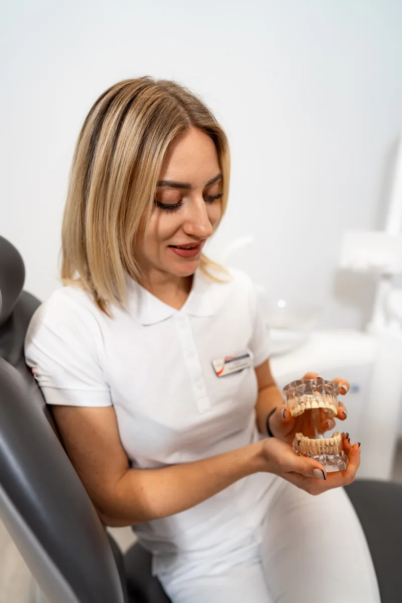 Dental professional demonstrating clear aligners as a cosmetic treatment option