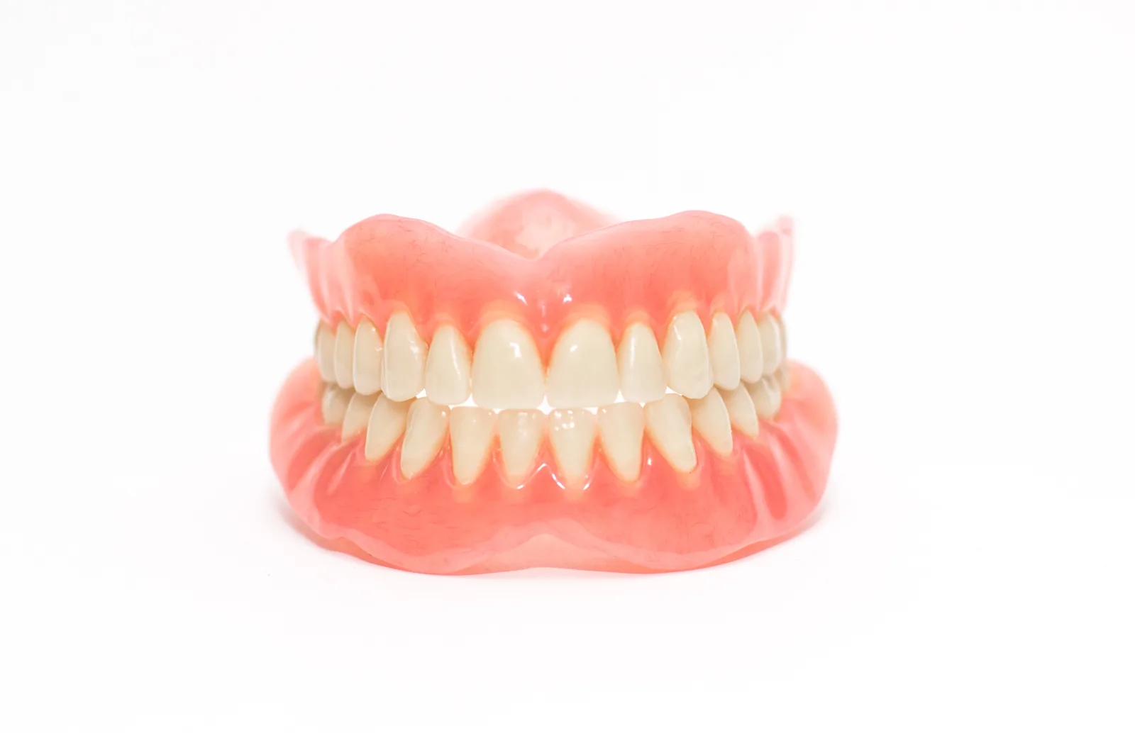 Upper and lower complete acrylic dentures for replacing missing teeth