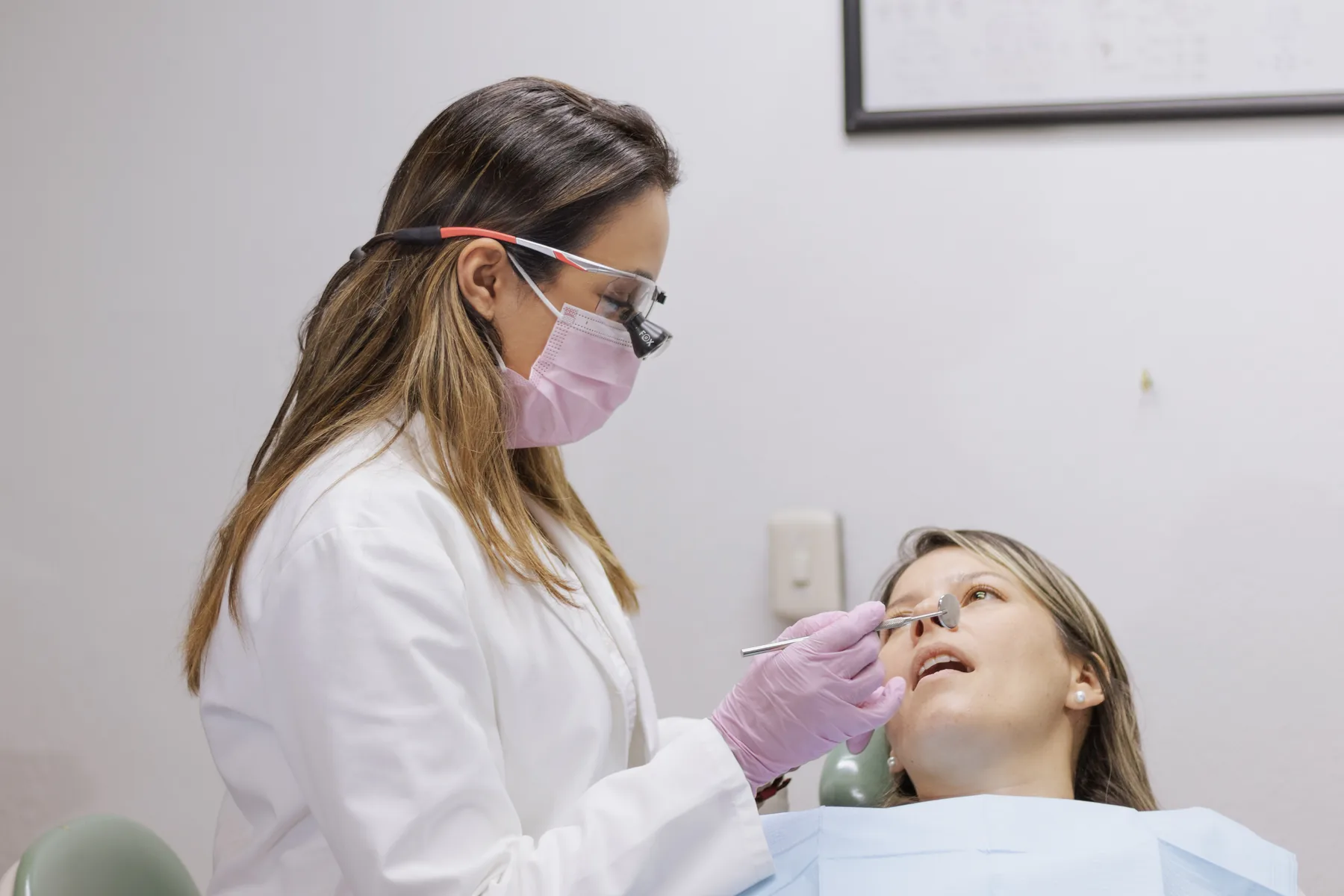 Dentist examining a patient during a routine dental checkup