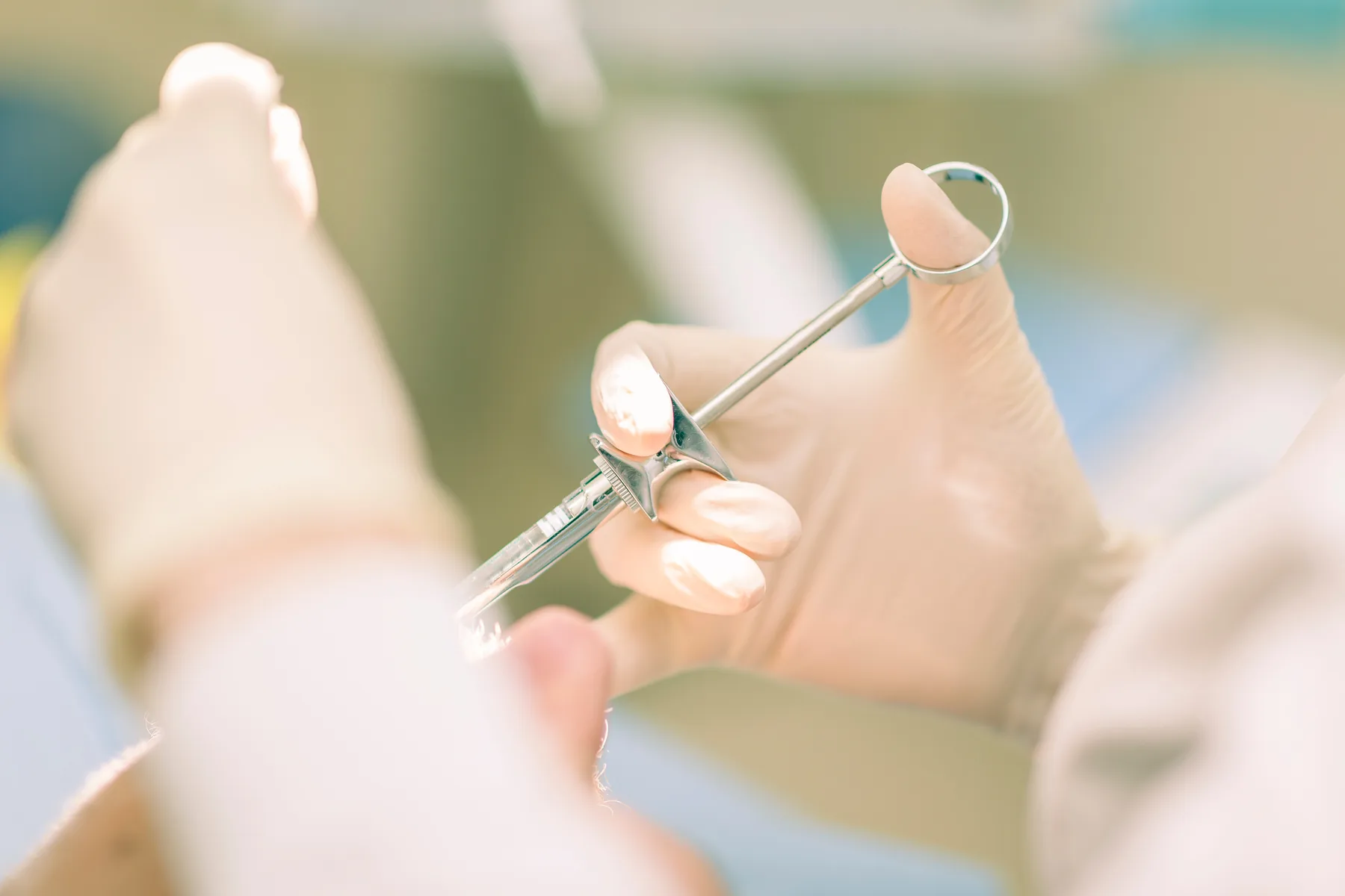 Dentist providing anesthesia during a root canal treatment procedure